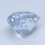 Side view of heated natural white sapphire measuring 8 mm in diameter