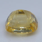 Side view of heated natural yellow sapphire showing rectangular cushion profile