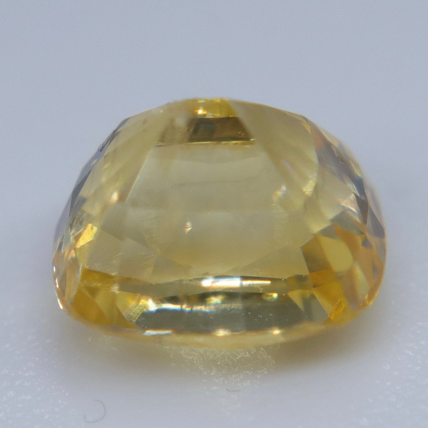 Side view of heated natural yellow sapphire showing rectangular cushion profile