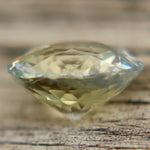 Light blue and pale yellow round cut sapphire from Ceylon
