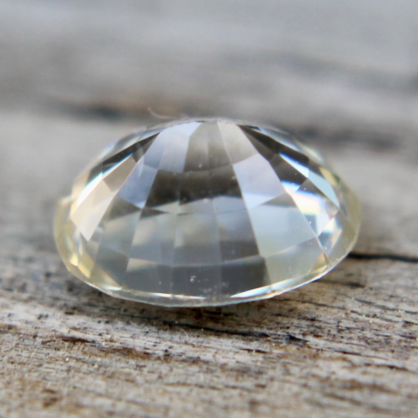 Oval yellow champagne sapphire showing lively brilliance in neutral light
