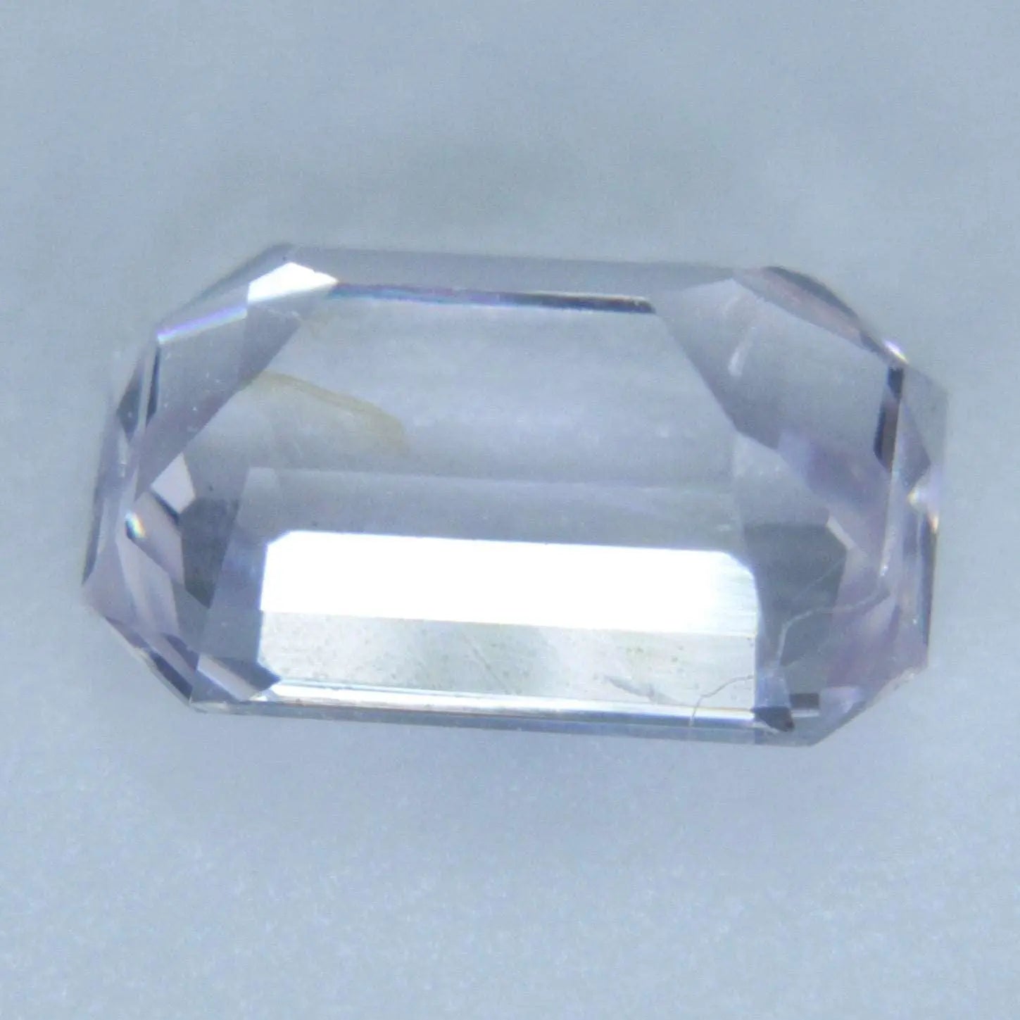 Loose pale pink/white sapphire 6.92×4.50×3.85 mm emerald cut, precision cut gemstone