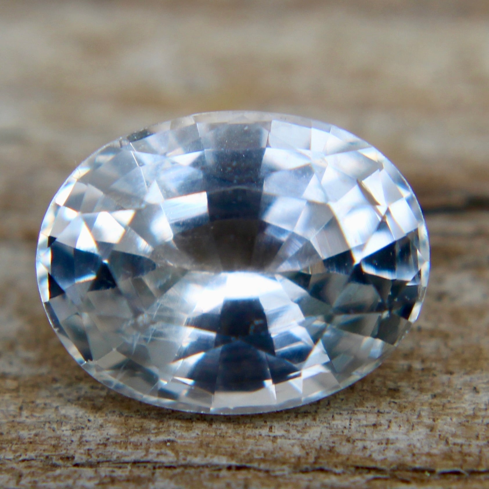 Loose oval cut white sapphire gemstone with brilliance