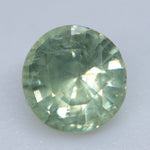 Pavilion view of an untreated Madagascar green sapphire showing its polished round facets