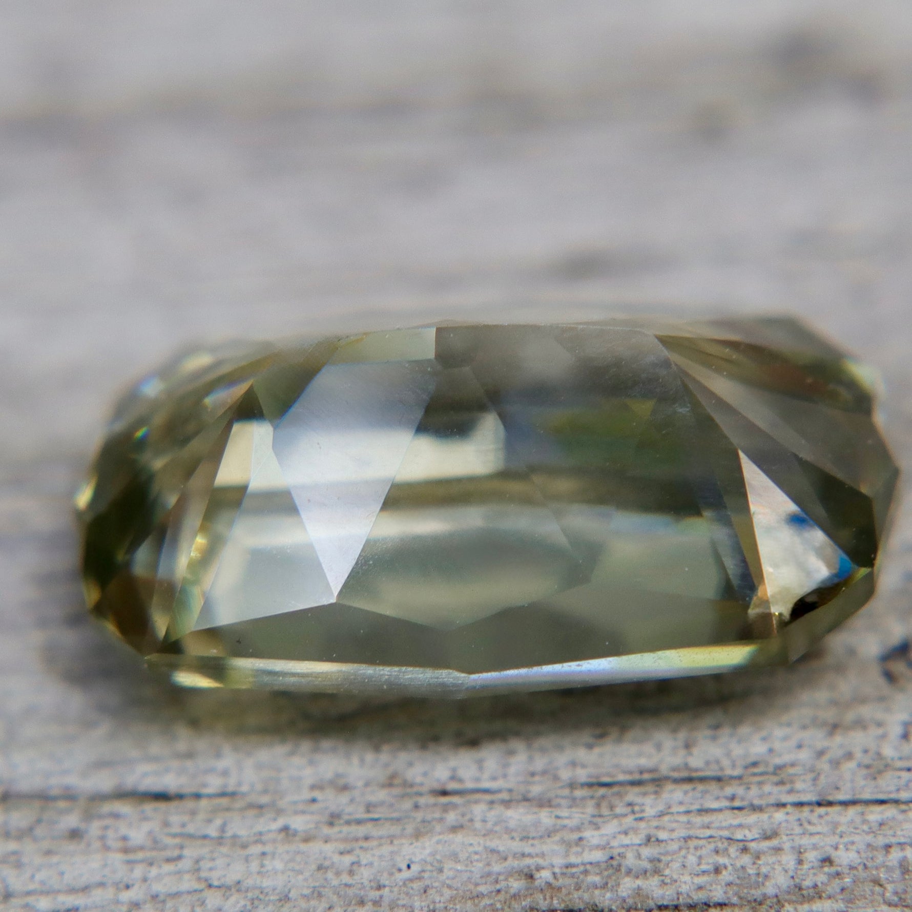 Side view of 7.49 carat elongated modified radiant chrysoberyl