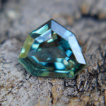 Side profile of unheated blue green sapphire, modified trillion cut, VS clarity
