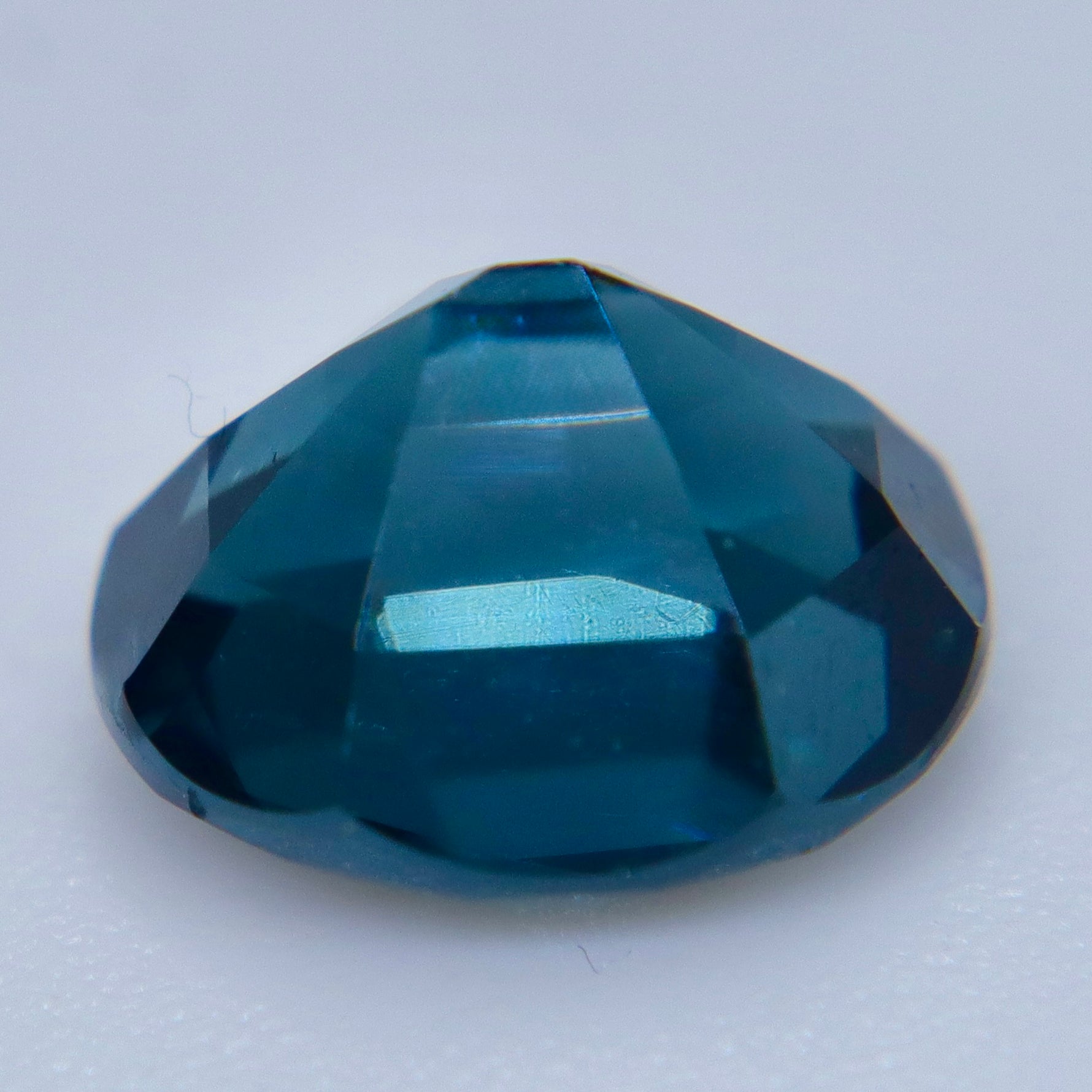 Pavilion view of a natural blue-green Ceylon spinel with oval faceting