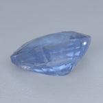 Side profile of a 0.88ct pear-cut blue sapphire showing its 3.46 mm depth and faceting