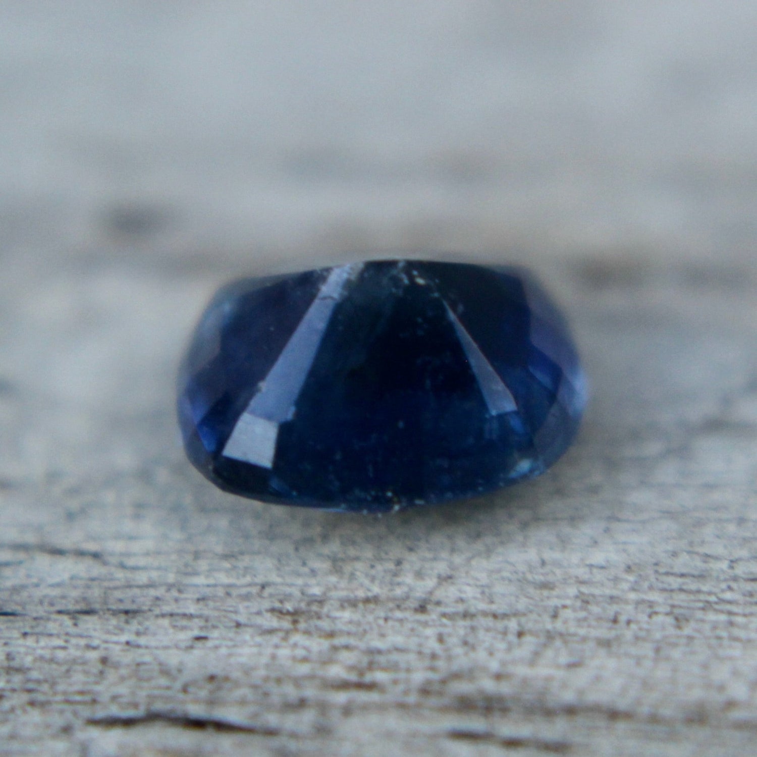 Heated blue sapphire 6.20×5.05×3.96 mm – side profile