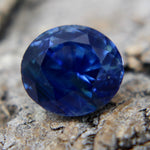 Side profile of oval sapphire showing depth and facets