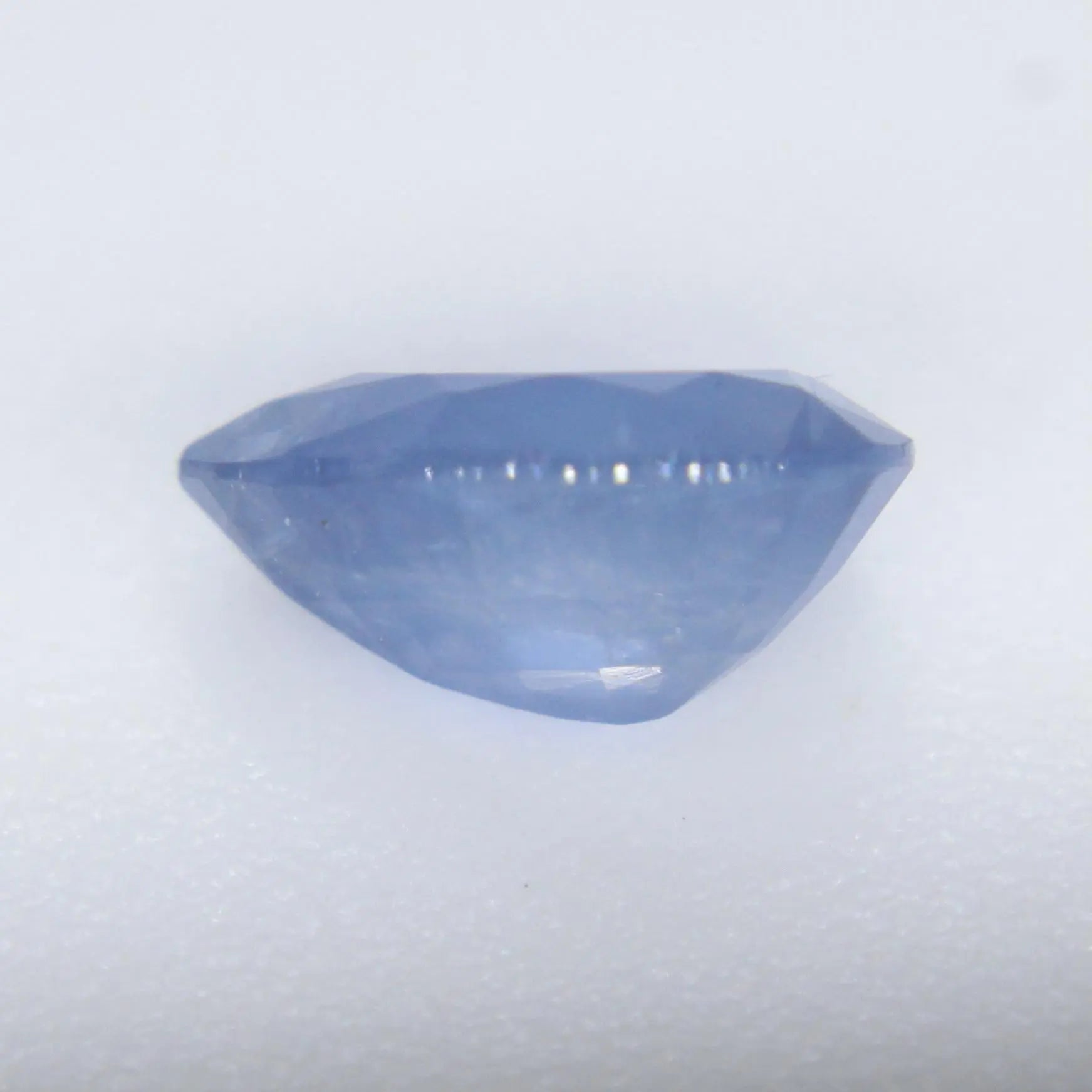 Small pear-shaped blue sapphire with rich color and sparkle