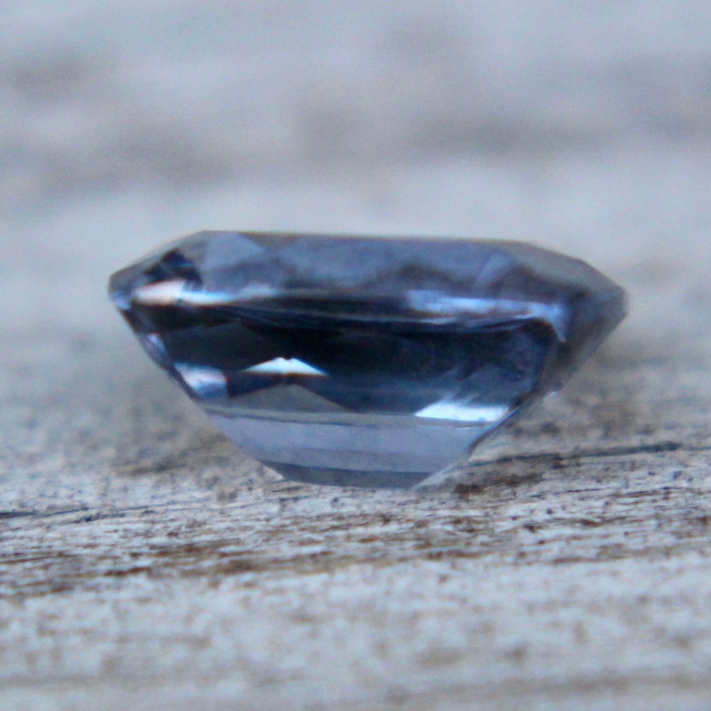 Unheated bluish‑purple spinel 0.82 carat cushion stone from Ceylon, eye‑clean clarity