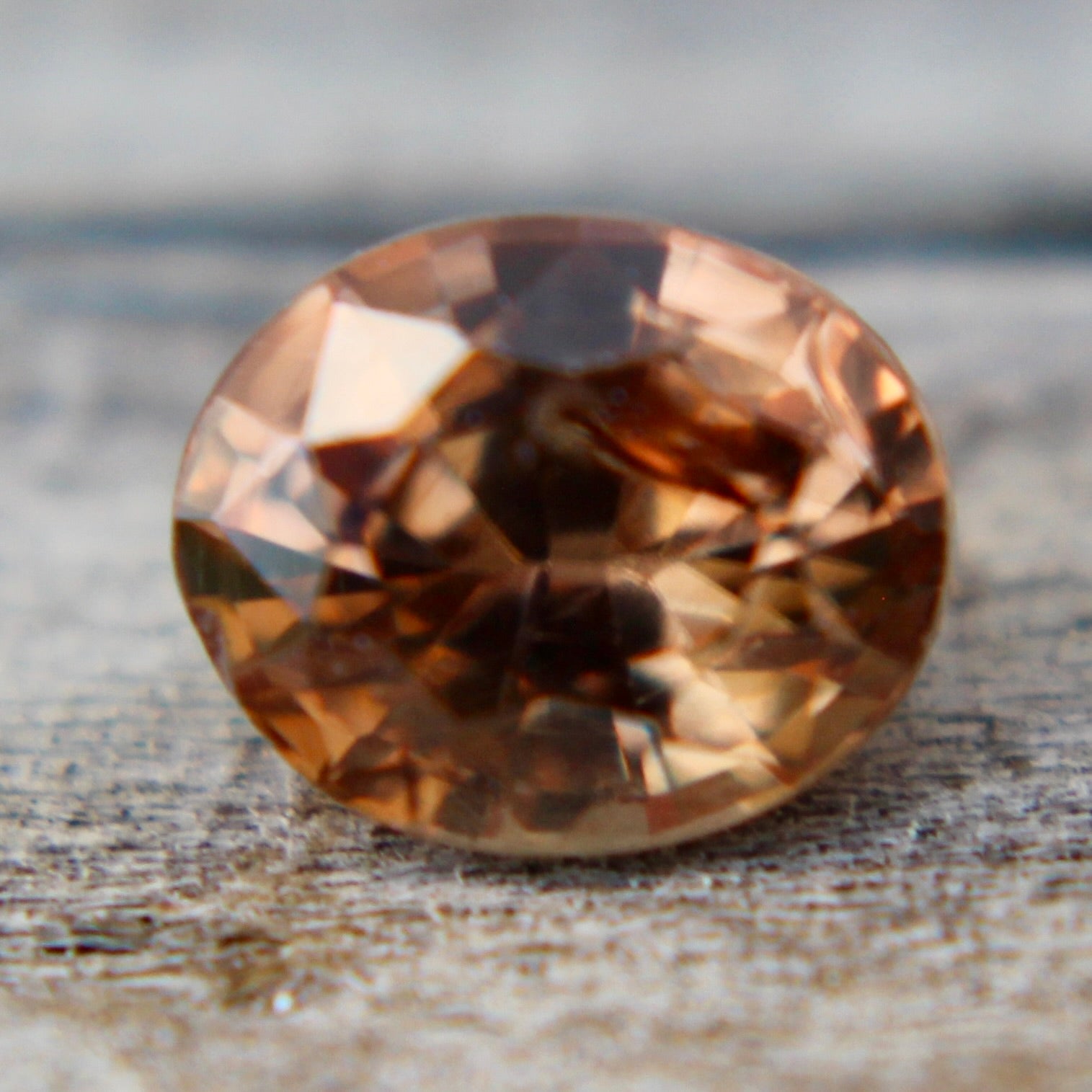 Close-up of faceted brown sapphire loose stone for custom fine jewelry designs