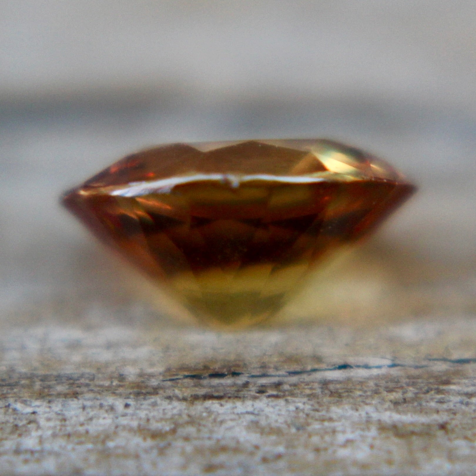 Unheated brownish orange sapphire 0.81 carat oval stone from Ceylon