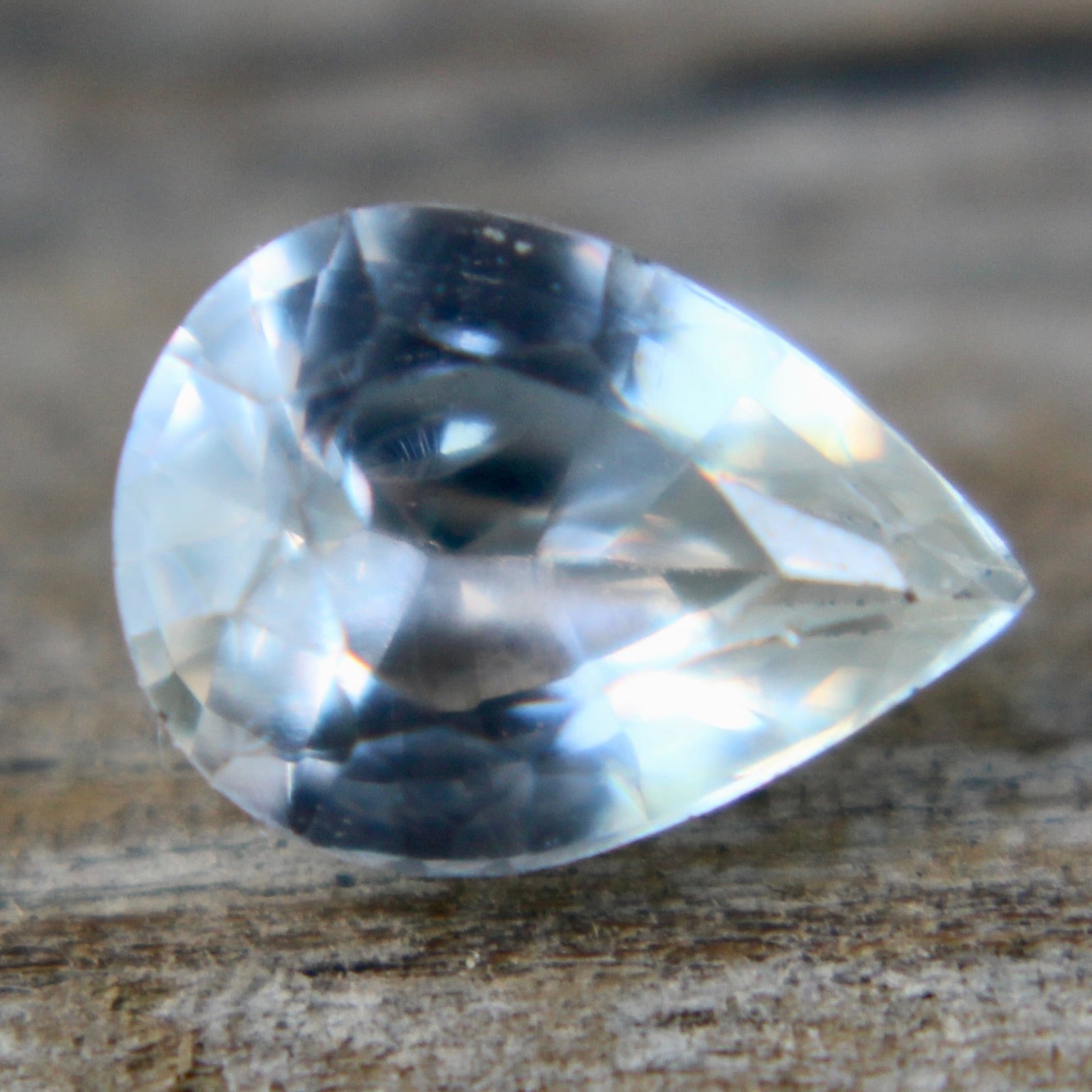 Natural pear-cut white sapphire under daylight – authentic Ceylon gemstone