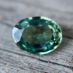 Faceted oval green sapphire 5.72x4.80mm ideal for bespoke jewelry designs