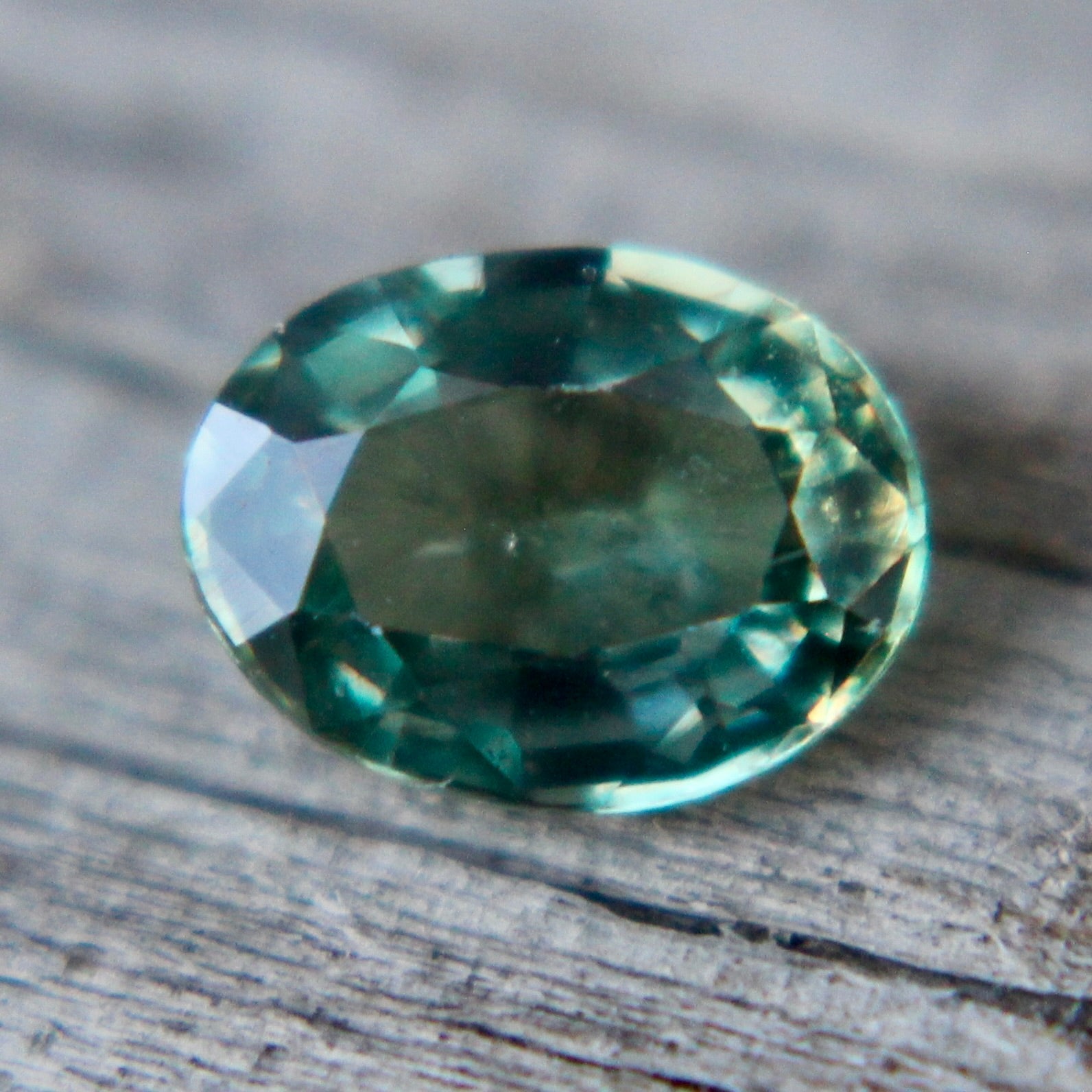 Faceted oval green sapphire 5.72x4.80mm ideal for bespoke jewelry designs
