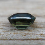 Cushion cut natural green sapphire 6.36 x 5.60 mm eye clean clarity