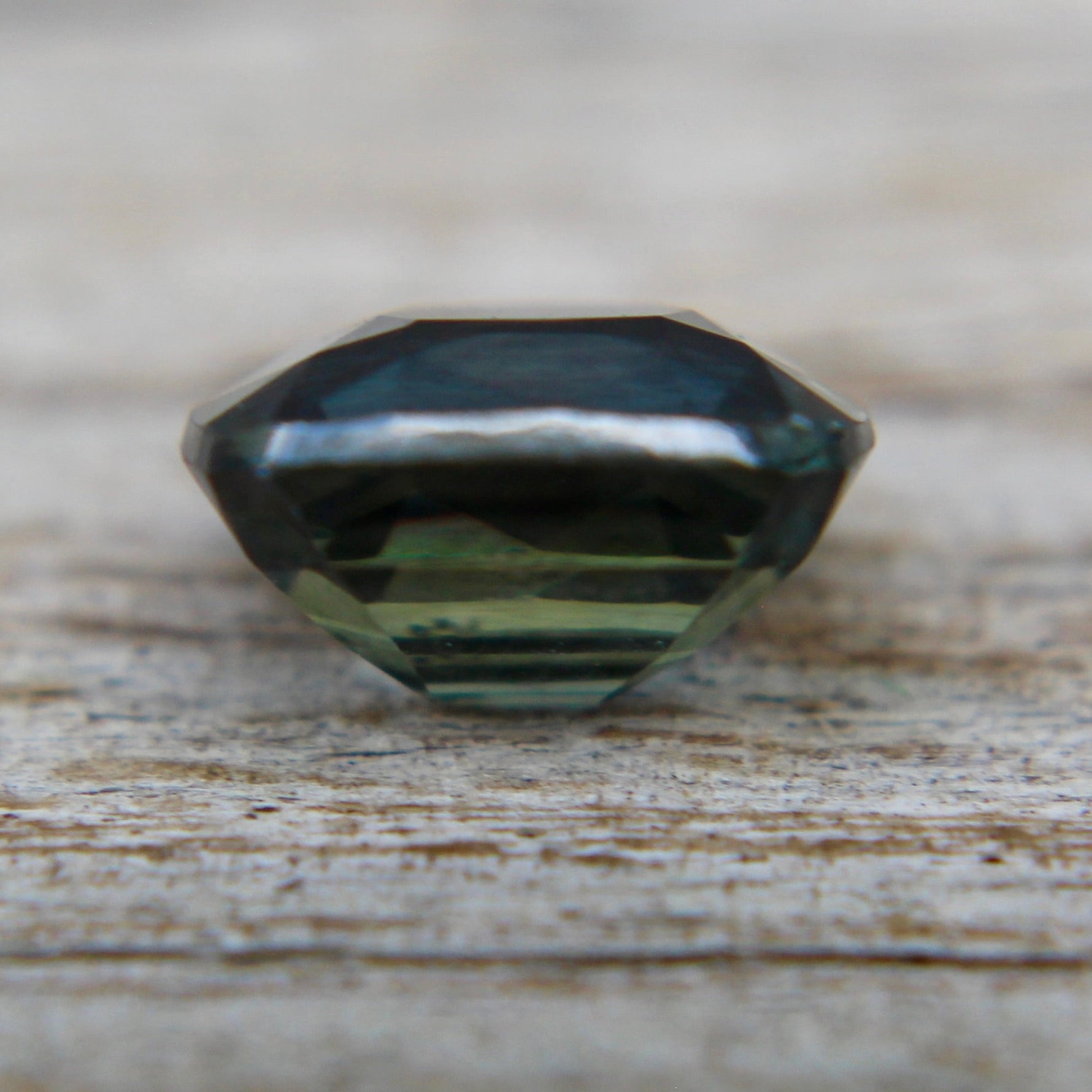 Cushion cut natural green sapphire 6.36 x 5.60 mm eye clean clarity