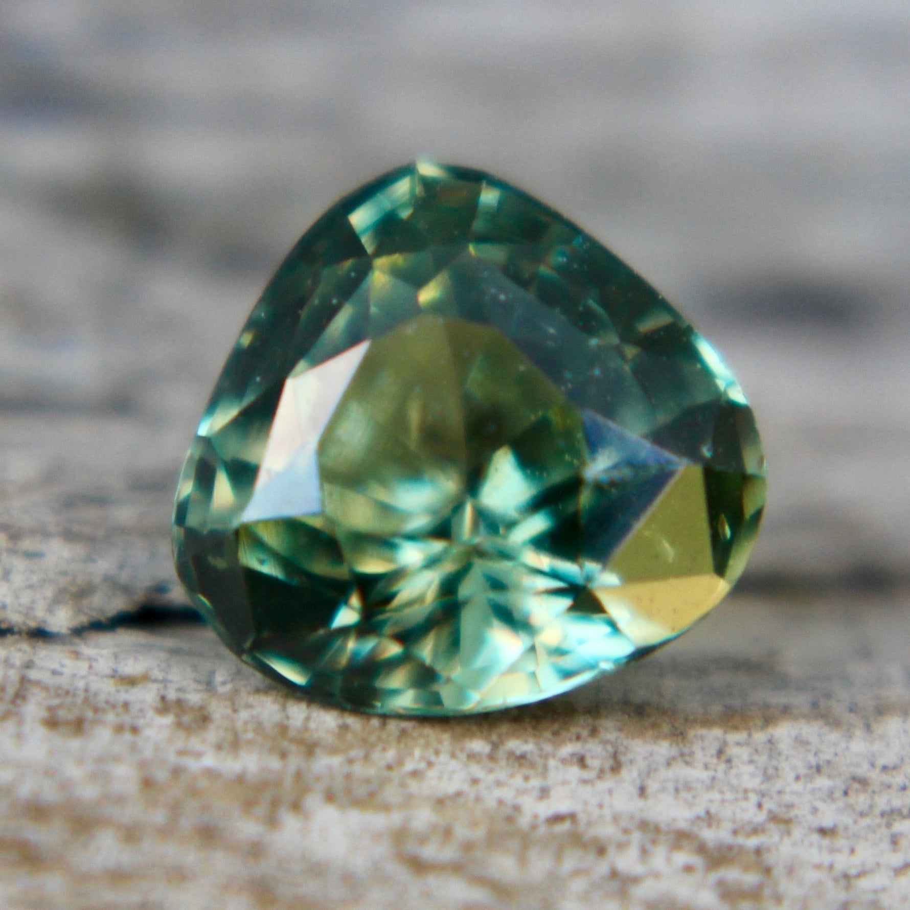 Brilliant green Ceylon sapphire under natural light – cut and polished gem for collectors