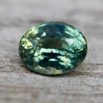 Transparent Ceylon green sapphire under daylight – earth-mined gem for jewelry design projects