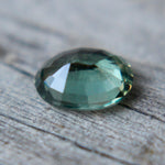 Loose green sapphire 0.56 carat oval cut for fine jewelry or engagement ring