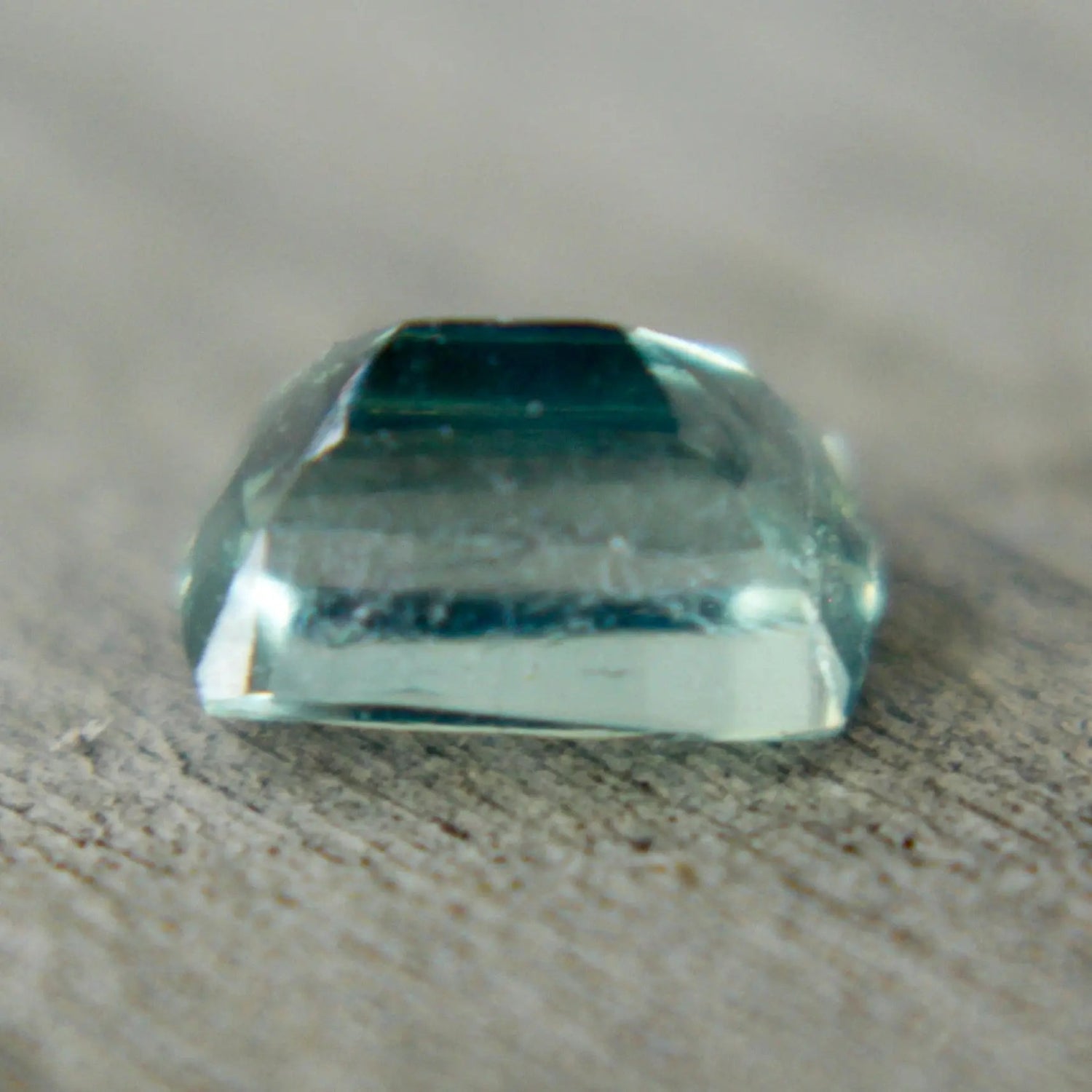 0.60ct Madagascar green sapphire, cushion cut, unheated untreated, eye-clean — macro under daylight