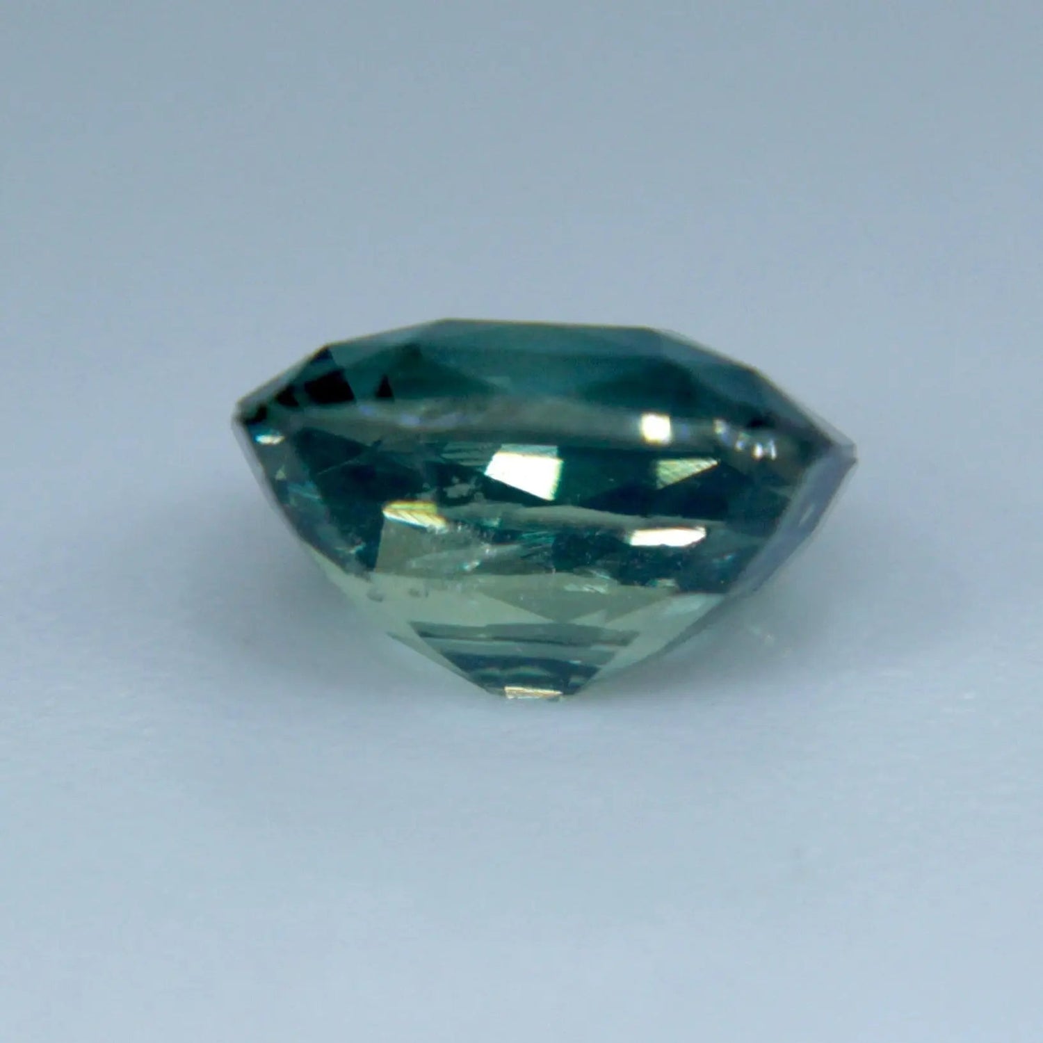 Cushion cut green sapphire loose gemstone 5.8 mm VS clarity stone