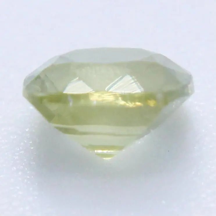 Cushion cut yellow green sapphire faceted gemstone for engagement ring