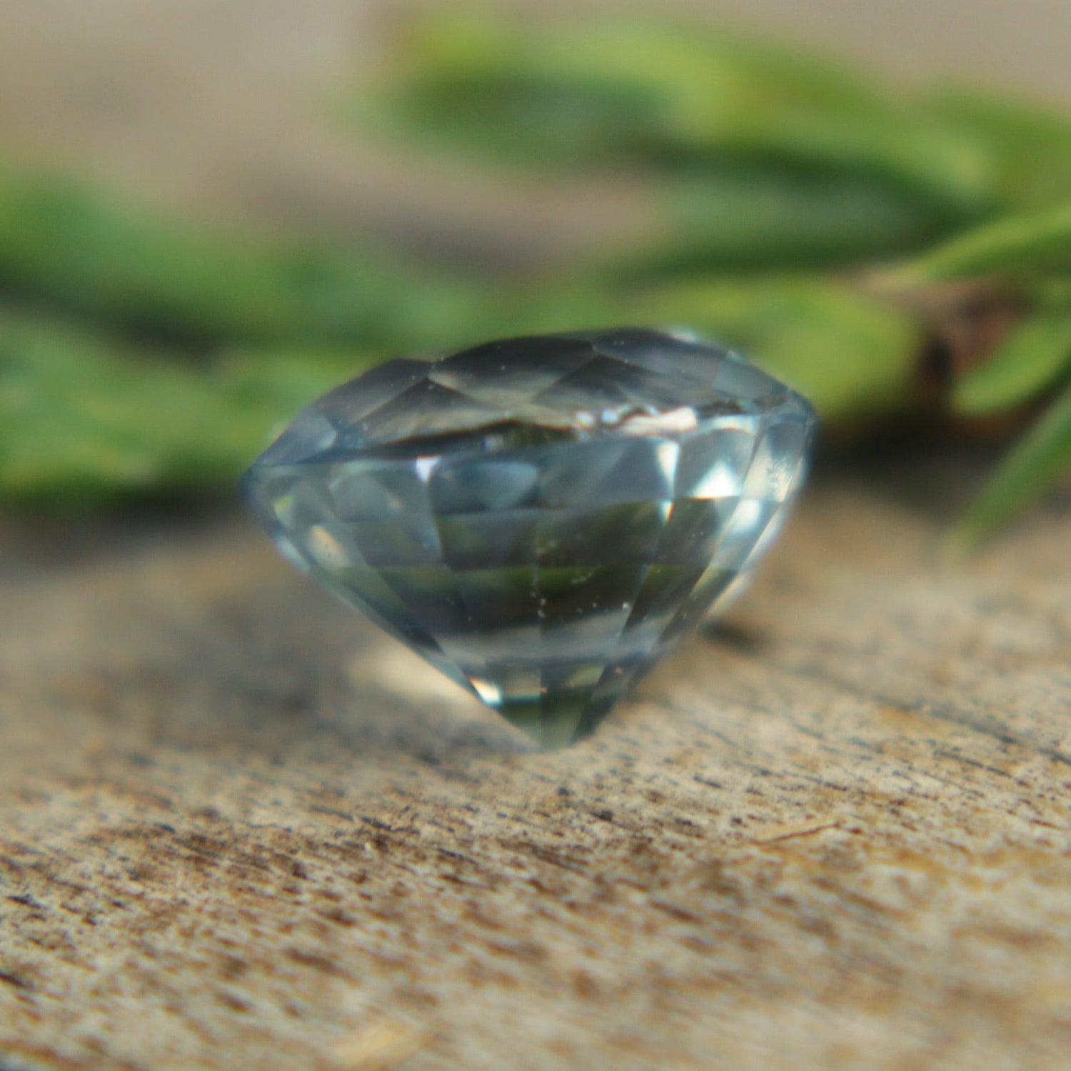 Side profile of oval pale blue sapphire showing 4.23mm depth