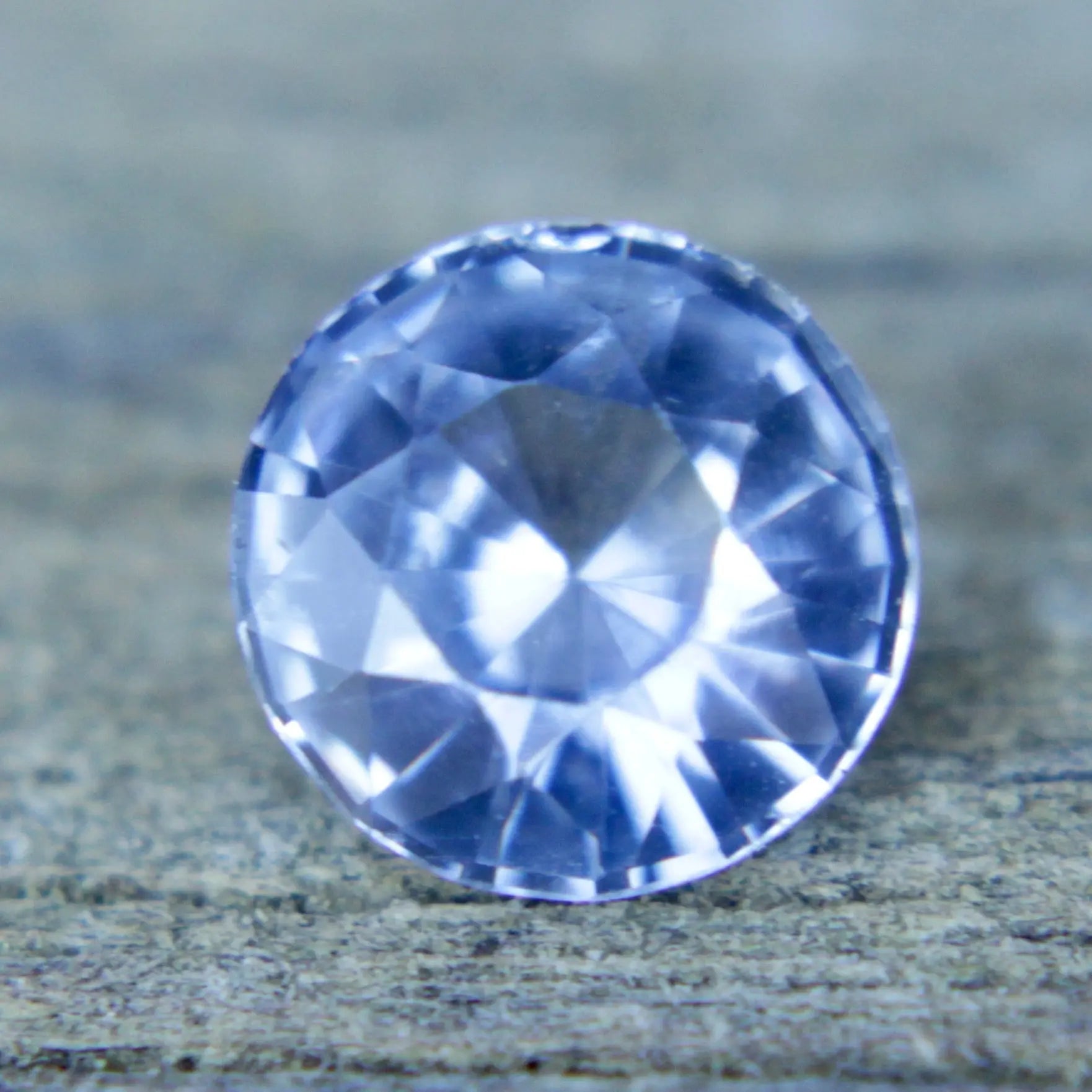 Authentic Ceylon sapphire round cut pale blue gemstone with certification