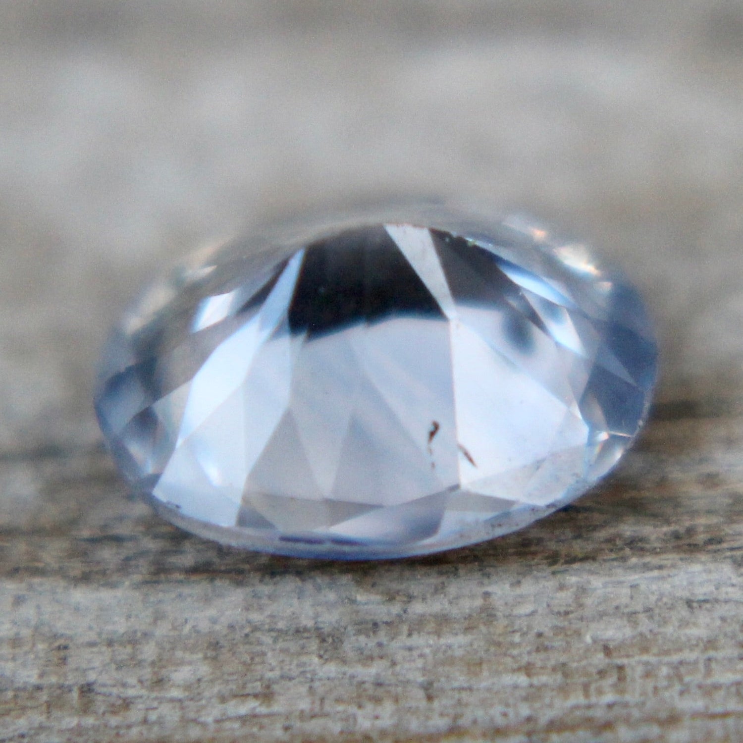Heated pale-blue sapphire 6.17×5.00×3.03 mm – side profile