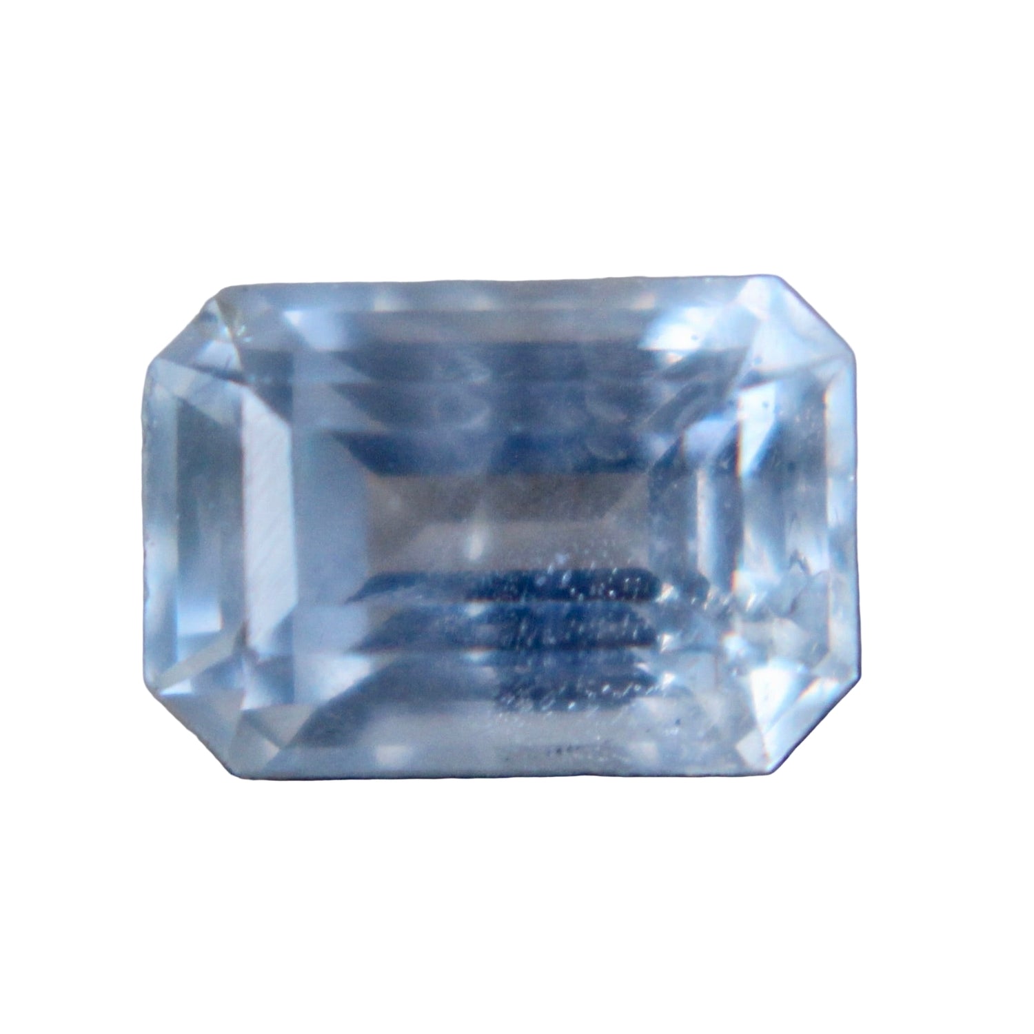 0.84 ct natural pale blue sapphire, Ceylon origin, emerald cut 6.00 × 4.18 × 3.10 mm, heated, I clarity