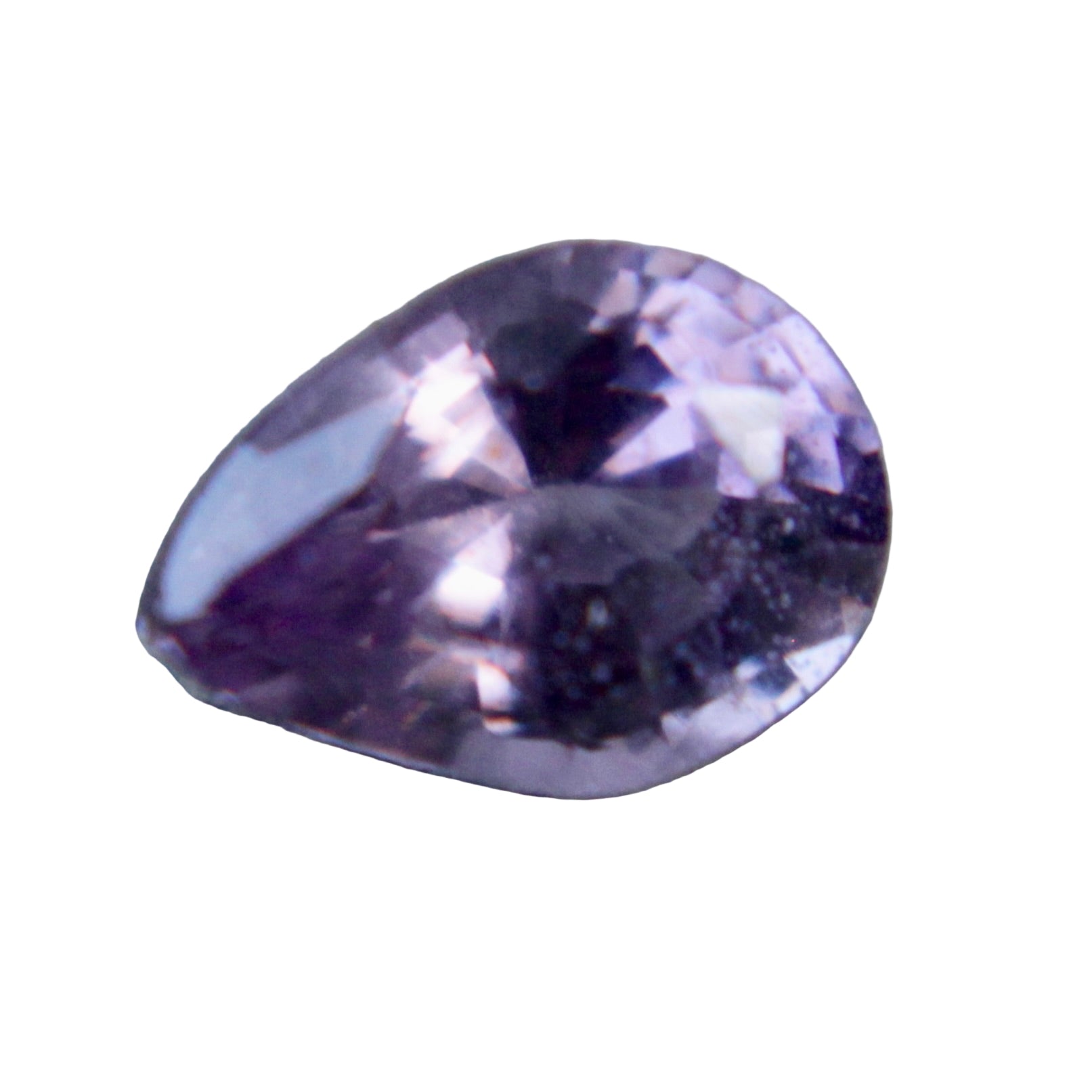 Pear‑cut purple sapphire 0.53 carat showing violet hue and facets under neutral light