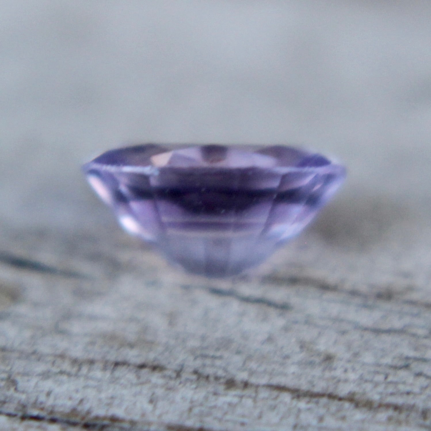 Unheated purple sapphire oval faceted gem with high clarity from Ceylon