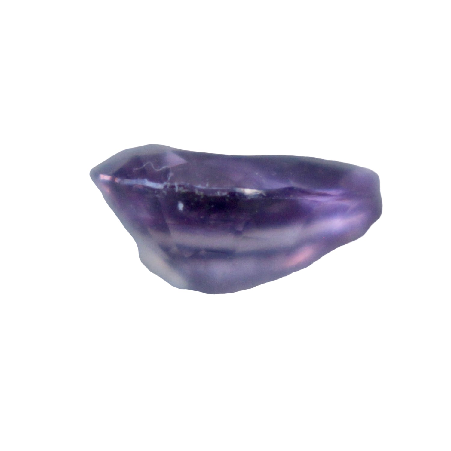 Ceylon purple sapphire on calipers measuring 5.93 mm × 4.43 mm; height 2.95 mm