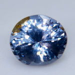Side view of Ceylon purple spinel showing polished facets and natural gemstone characteristics