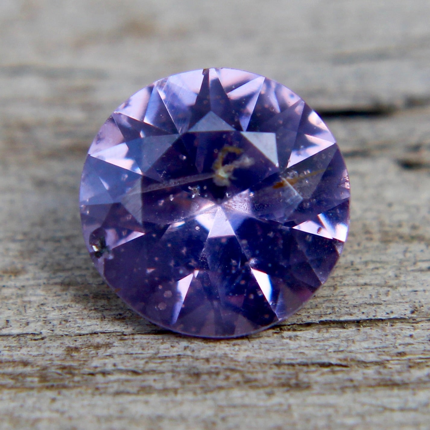 Side profile of untreated purple spinel, I clarity, round cut