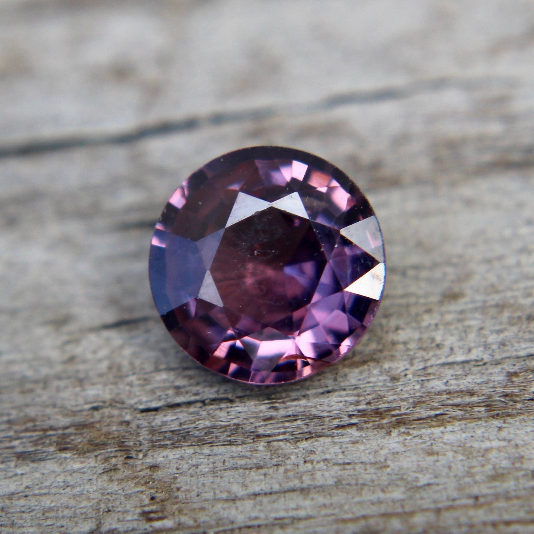 Untreated purple spinel gemstone under natural light – certified authenticity