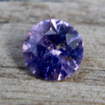 Round purple spinel showing vivid lavender-violet hue and fine faceting