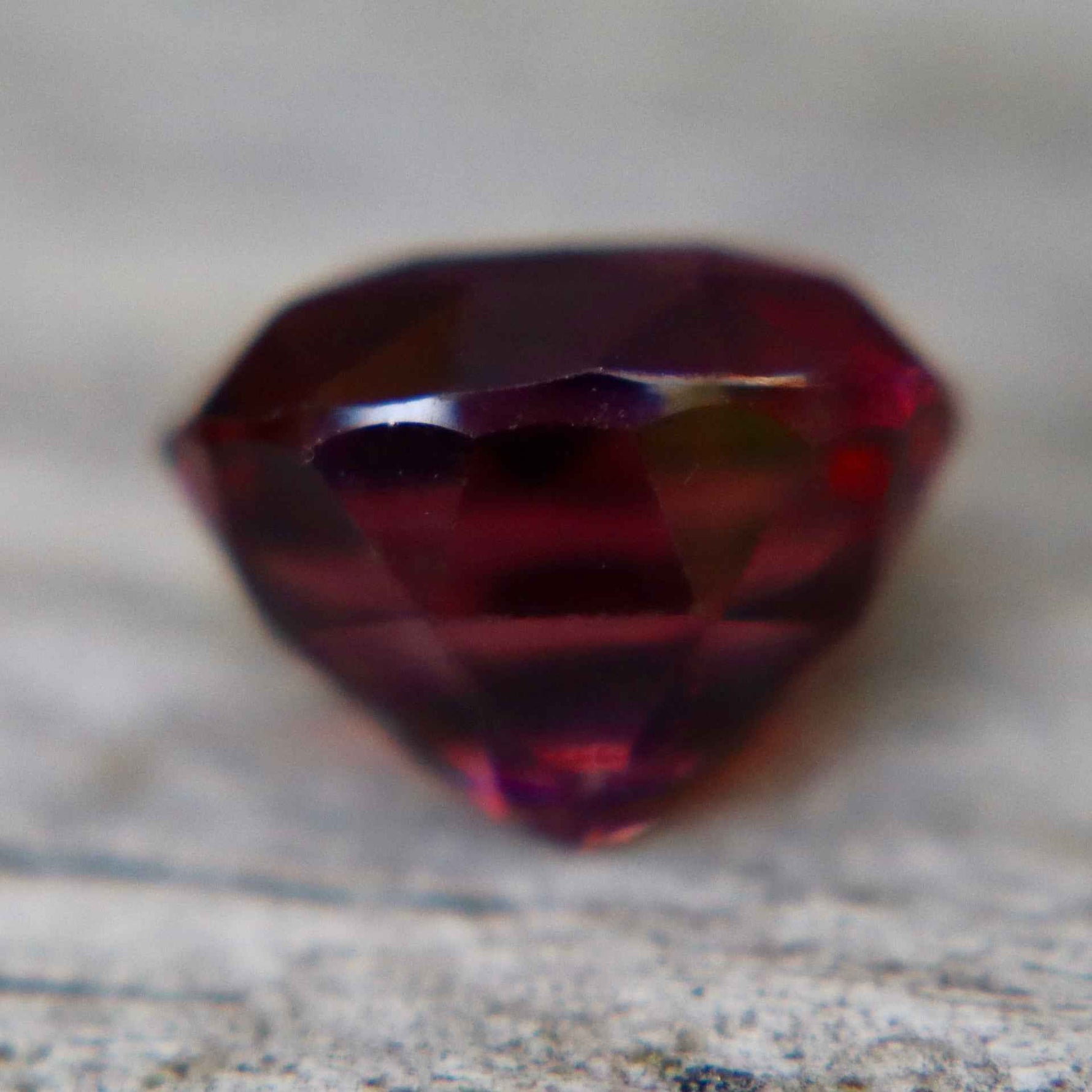 Natural oval-cut red spinel measuring 8.15 by 6.50 mm