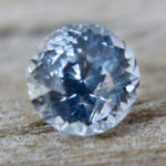 High clarity 1.45ct round cut white sapphire with soft blue hue