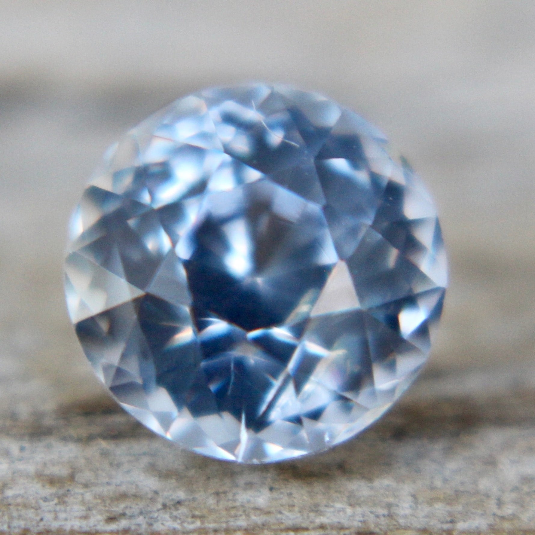 Transparent round cut white sapphire 1.45ct with authenticity confirmation card