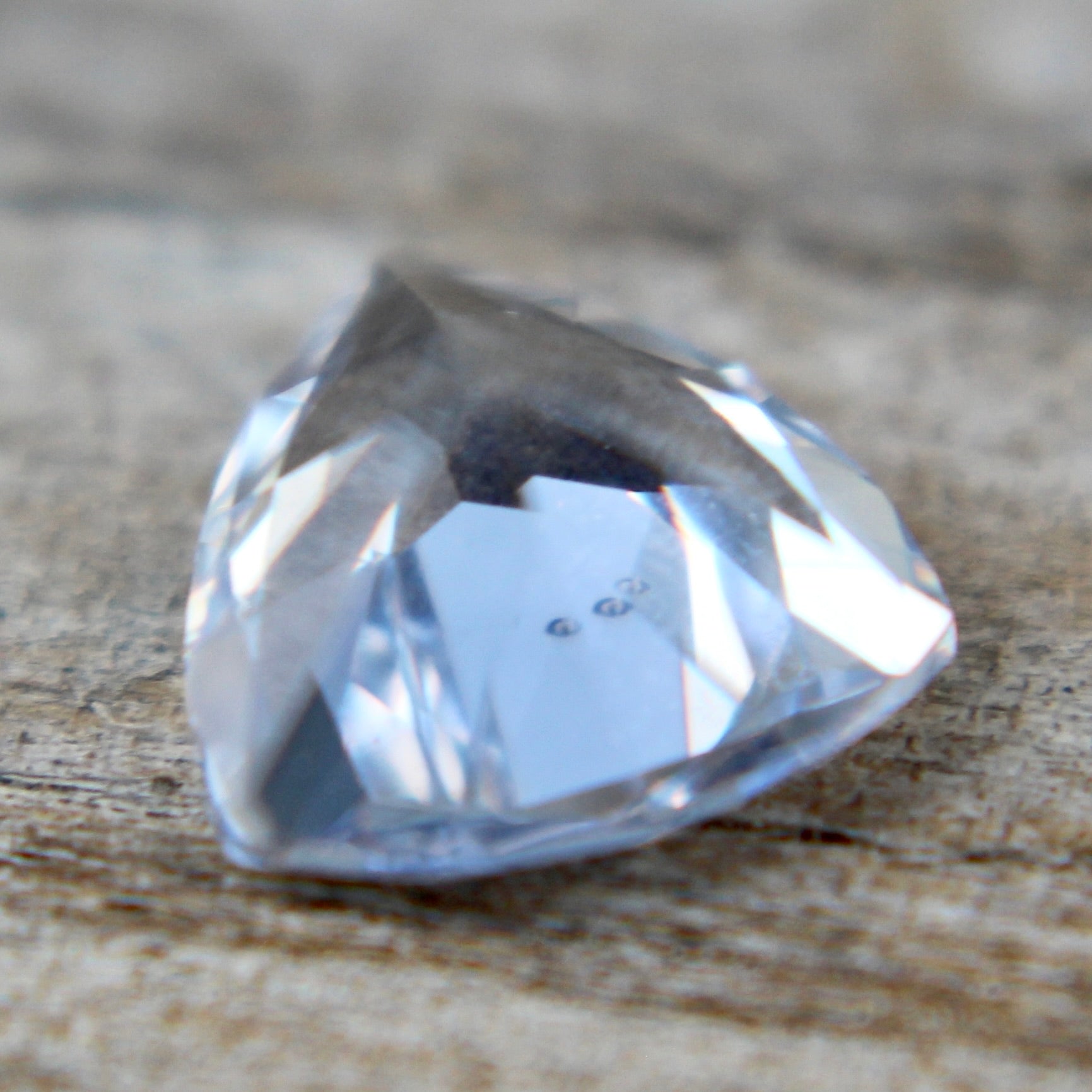Unheated colourless sapphire 6.00×5.90×3.70 mm – side profile