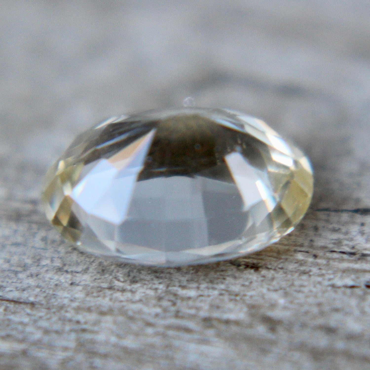 Unheated untreated white sapphire 1.16 carat oval cut with slight yellow hint.
