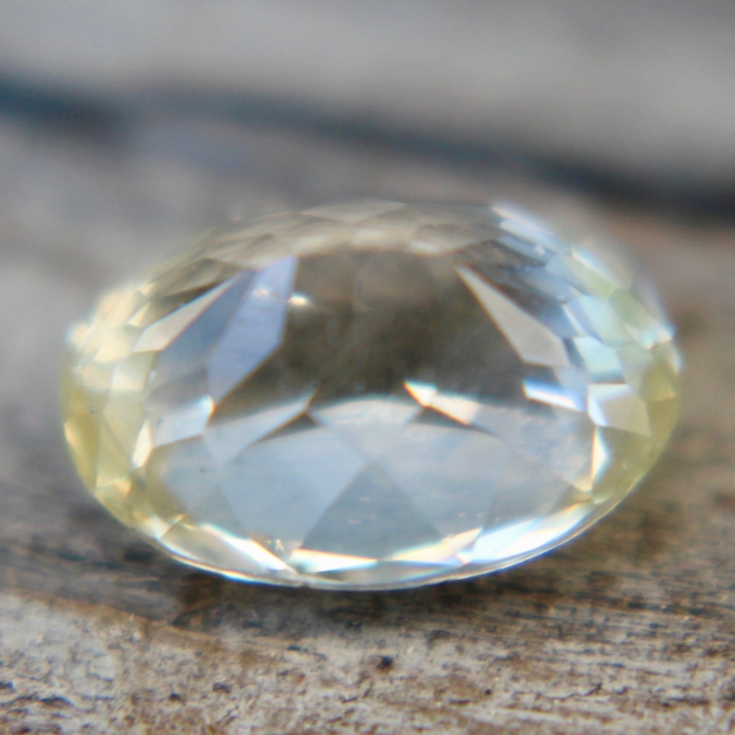 Unheated white sapphire with faint yellow hue, 7.65×5.51×4.24 mm
