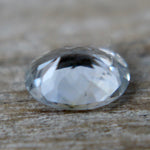 Unheated white sapphire oval gemstone with slight blue tone