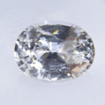 Face-up view of white sapphire 6.23 × 4.90 mm with bright scintillation