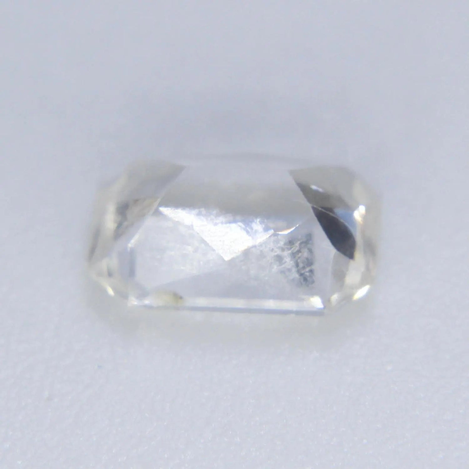 Eye clean step cut white sapphire diamond alternative for engagement ring