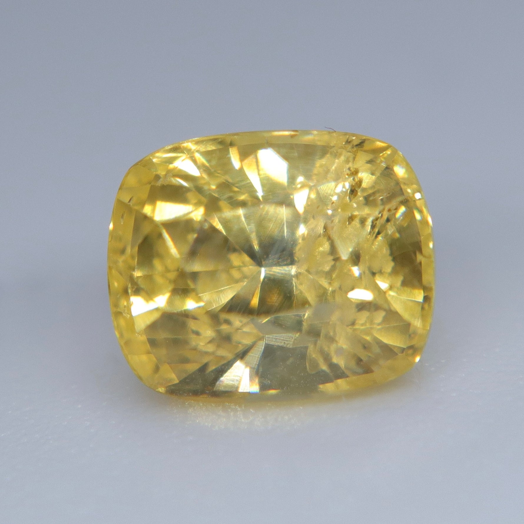 Natural cushion-cut yellow sapphire suitable for a custom ring or pendant